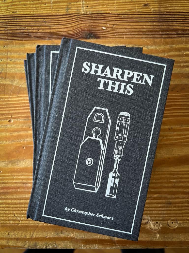 Stack of Sharpen This books shown on a workbench